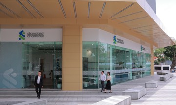 Standard Chartered: NHNN phải hỗ trợ VND để tránh nhập khẩu lạm phát