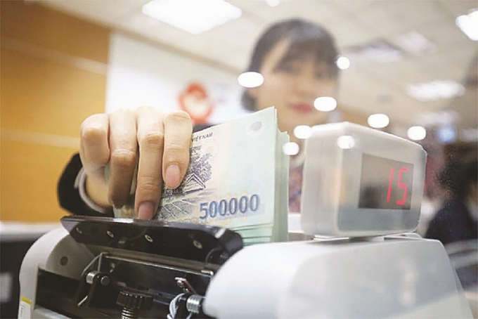 Ngân hàng Nhà nước báo cáo gì về vấn đề tái cơ cấu và xử lý nợ xấu?